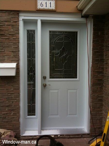 Front door with sidelight cost effective.  Half light in slab and full sidelight. Plymouth Classic stained glass catalog. Beveled Glass with zinc caming